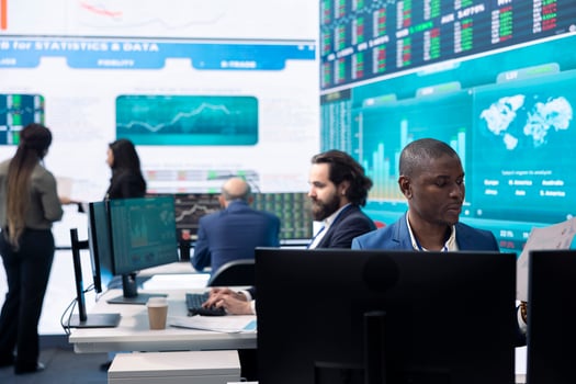 Business analyst looking into statistics and reports to detect any obstacles within the project structure, preparing solutions to ensure productivity. Manager studies firm numbers. photo