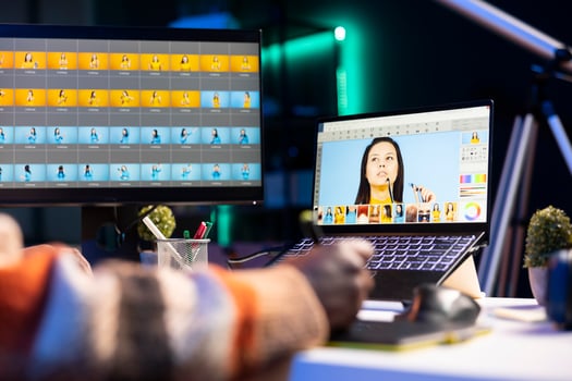 Professional graphic designer retouching images on dual monitors in a creative office environment, demonstrating multitasking skills and innovative techniques. Well organized editor. photo
