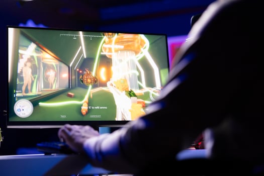 Man playing videogames, ready to start defeating enemies in first person shooter game, relaxing at home. Close up shot of pro gamer unwinding by competing in online multiplayer esports tournament photo