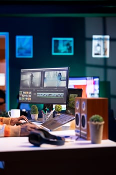 maker producing footage with artistic editing software, doing color adjustment and special effects. Digital videographer illustrator developing transitions for cinematic production. photo