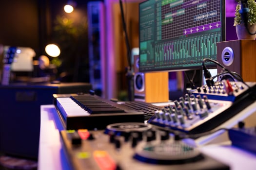 Empty home studio used to create music with electronic console and devices, pre amp knobs and soundboard with control panel. Space equipped with amplifier and tools, mixing and mastering. photo