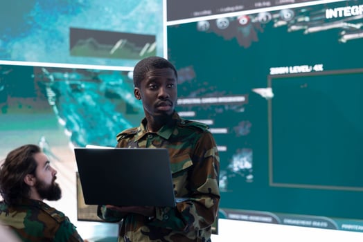 Commanding general of a division reviews warfare information within old mission files, special operation reconnaissance supporting field troops with crucial data. Briefing his military squad. photo