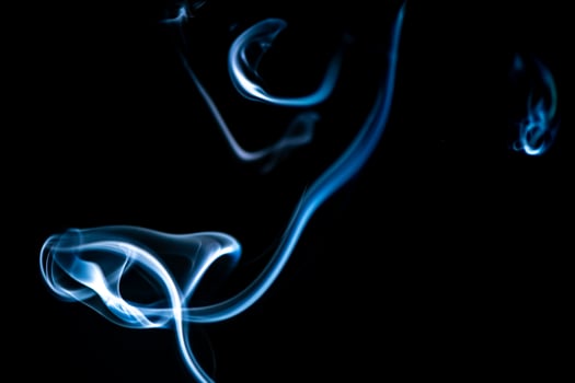 blue smoke, vapor, fog cloud on black background for using in composition and overlay photo