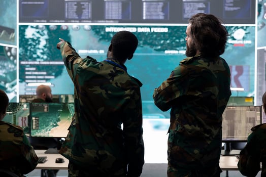 Infantry unit staff talking about enemy vessel gps location in control center, analyzing real time information for national safety mission in command post. Army personnel gathering intelligence. photo