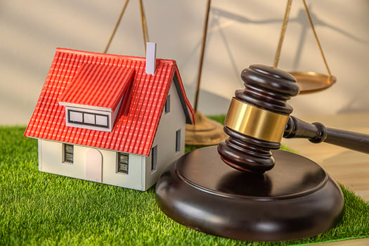 Law concept, Lawyer hands holding judge and house model photo