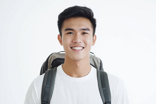 Asian young man with backpack smiling photo