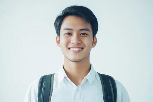 Asian male student smiling with backpack photo