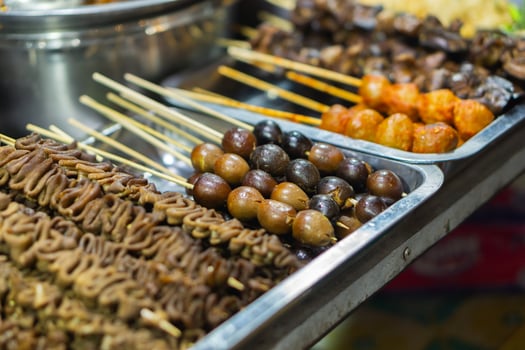 Street food in Yogyakarta at night market life. Culinary tour for tourists photo