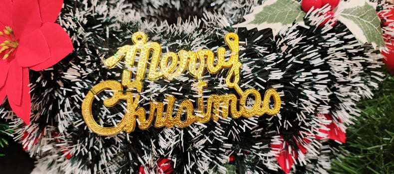 A close up of text Merry Christmas decoration for New Year and Christmas eve xmas event photo
