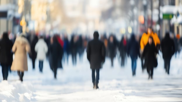 Blurred crowd of festive people enjoying winter season in a snowy urban setting photo