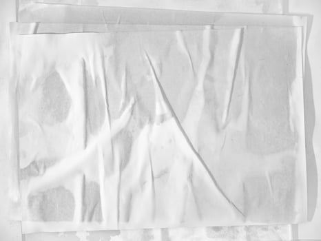 Blank white paper texture poster glued on the wall photo