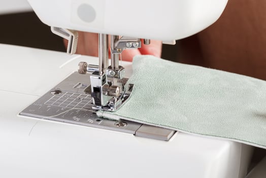 Sewing machine, stitching fabrics, needle in a round plan photo