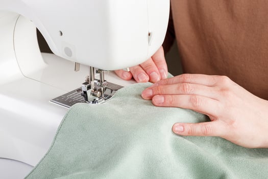 Sewing machine, stitching fabrics, needle in a round plan photo