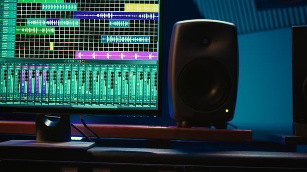 Professional studio control room with pre amp knobs and faders, key buttons on recording desk, soundproof space. Audio mixer and regulator used to produce music, technical equipment. photo