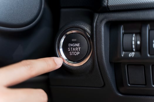 Close up of someone trying to ignition car by push start button. photo