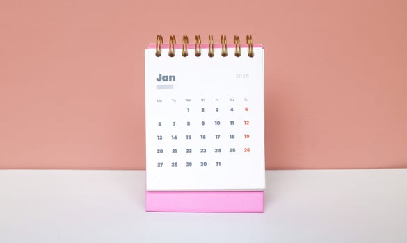 January month first of year 2025 in calendar 2025 in pink isolated on pink background. Calendar and Note Pad Happy New year 2025. Zoomed in first of january 2025 in calendar photo