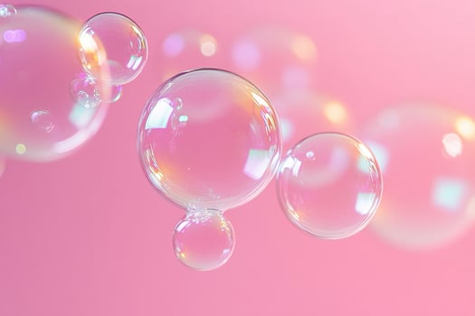 Transparent Soap Bubbles on a Pastel Pink Background for Vibrant and Creative Design Projects photo
