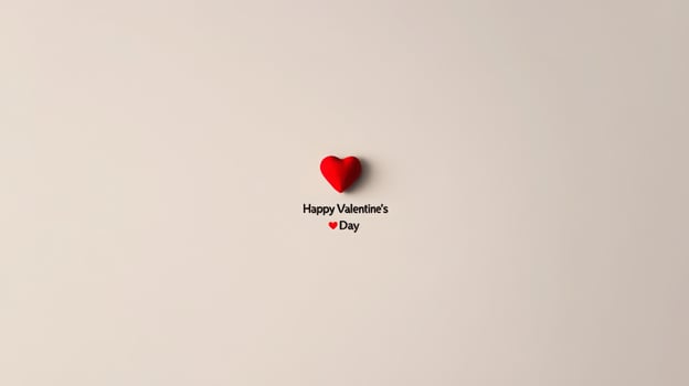 A simple yet striking representation of love features a bold red heart placed centrally with a message wishing a happy Valentine's Day. This design evokes feelings of warmth and affection. photo