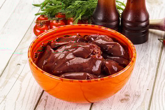 Raw chicken liver uncooked in the bowl photo