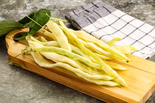 Raw green bean strings heap photo