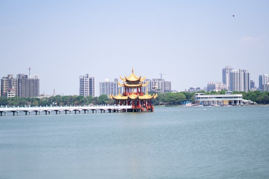 Spring Autumn Pavilion and Lotus Pond with Kaohsiung City Skyline photo