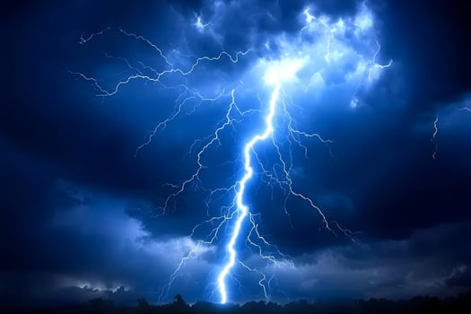 Dramatic lightning bolt striking during a powerful thunderstorm. photo