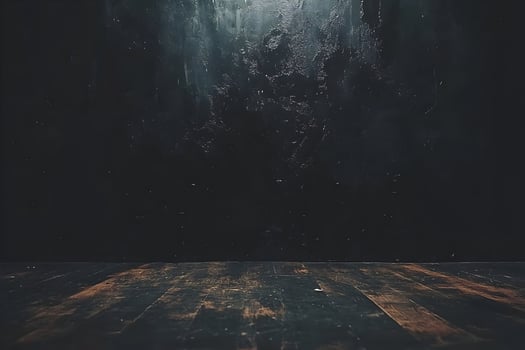 Dark wooden floor against a textured black wall background. photo