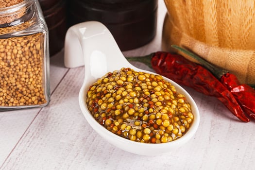 Spicy mustard sauce with seeds photo