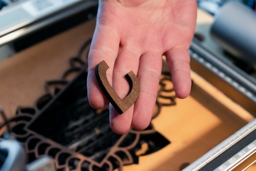 Laser engraving and cutting, using reclaimed wood, upcycling concept photo