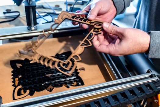 Laser engraving and cutting, using reclaimed wood, upcycling concept photo