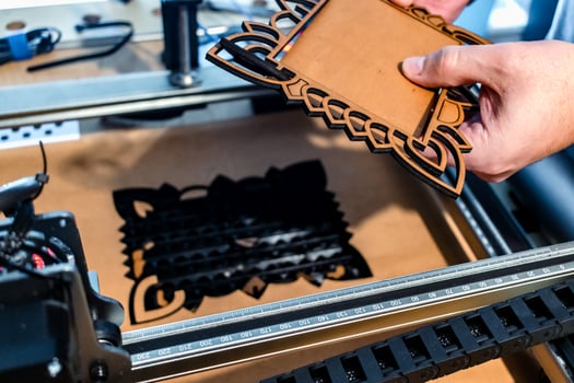 Laser engraving and cutting, using reclaimed wood, upcycling concept photo