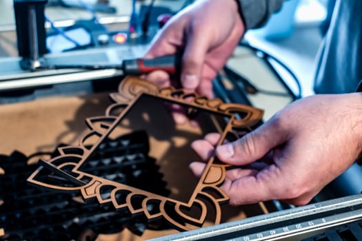 Laser engraving and cutting, using reclaimed wood, upcycling concept photo