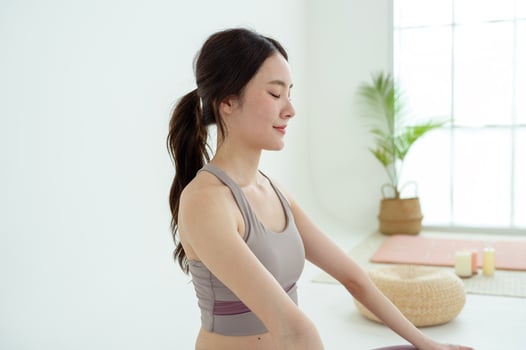 Asian woman in sportswear exercising and doing yoga photo