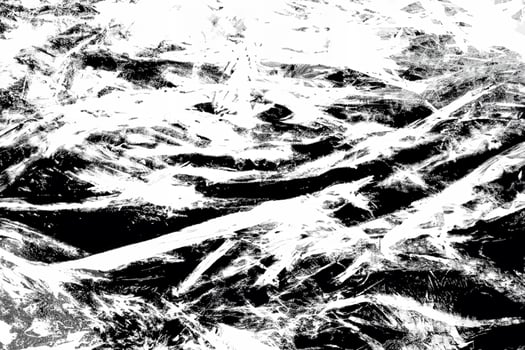 High-contrast abstract texture with chaotic black and white streaks and rough grunge patterns, ideal for backgrounds. photo