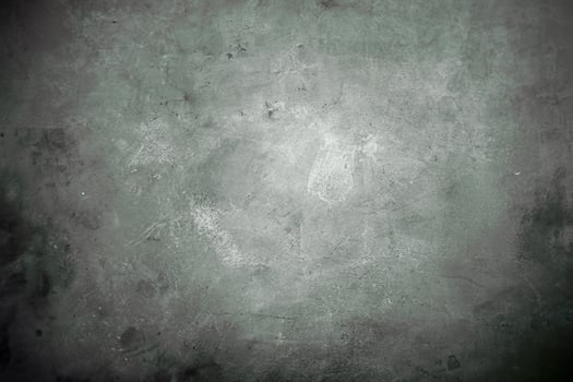 Soft, green-toned grunge background with subtle texture, concrete surface patterns, and faded, weathered appearance. photo
