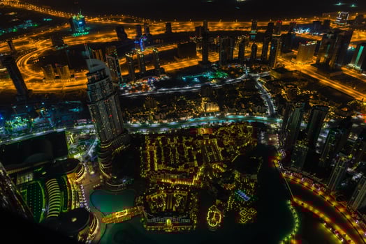 Dubai downtown night scene with city lights. Top view photo