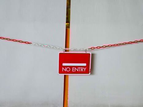 Red board no entry sign in the area where unauthorized access is prohibited. photo