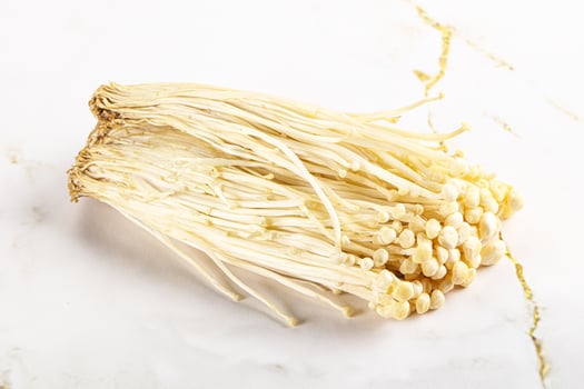 Tasty raw enoki mushroom heap photo