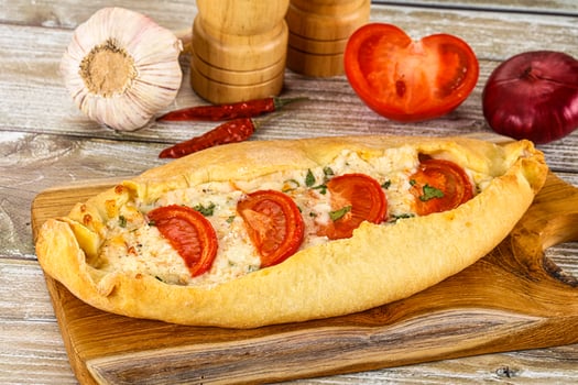 Turkish Pide with cheese and tomato photo
