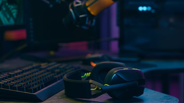 Addict Caucasian man guy streamer vlogger putting on headphones male gamer blogger prepare for stream radio broadcast influencer player talking communicate microphone mic at home play online game vlog photo