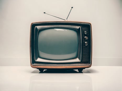 Vintage television set with rabbit ear antennas, showcasing a retro design and nostalgic charm. photo