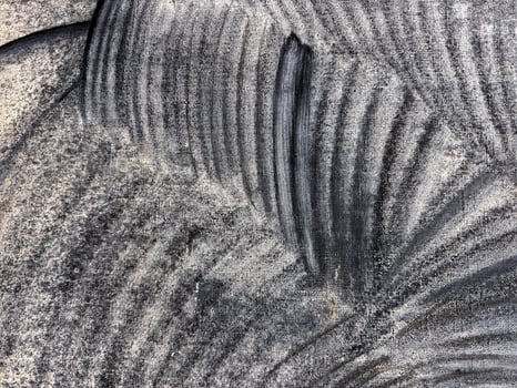 Unique texture patterns created by layered black and gray lines on a surface photo