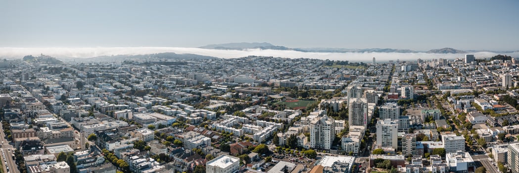 Panoramic aerial view of San Francisco showcasing cityscape and coastal fog near California photo