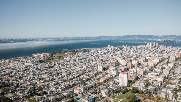 Vibrant panoramic aerial view of San Francisco showcasing the cityscape, coastal waters, and surrounding hills in California photo