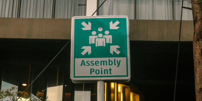 A sign that says assembly point photo