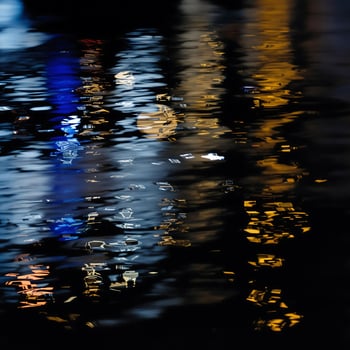 Abstract Reflection of City Lights on Rippling Water photo