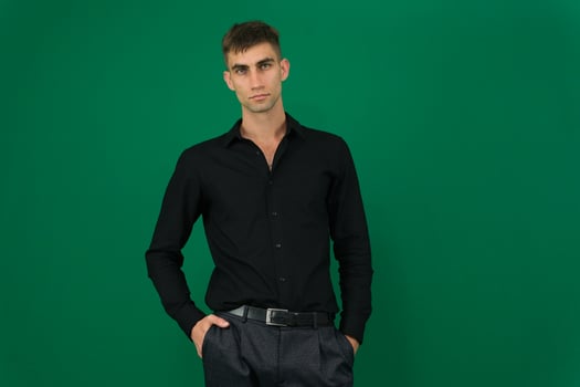 Man wearing black t-shirt on light grey background, closeup. Mockup for design photo