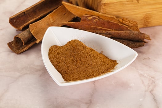 Natural Cinnamon powder with sticks photo