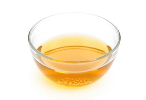 A glass of liquid on a white background photo