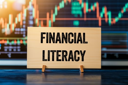 Financial literacy message on a wooden sign photo
